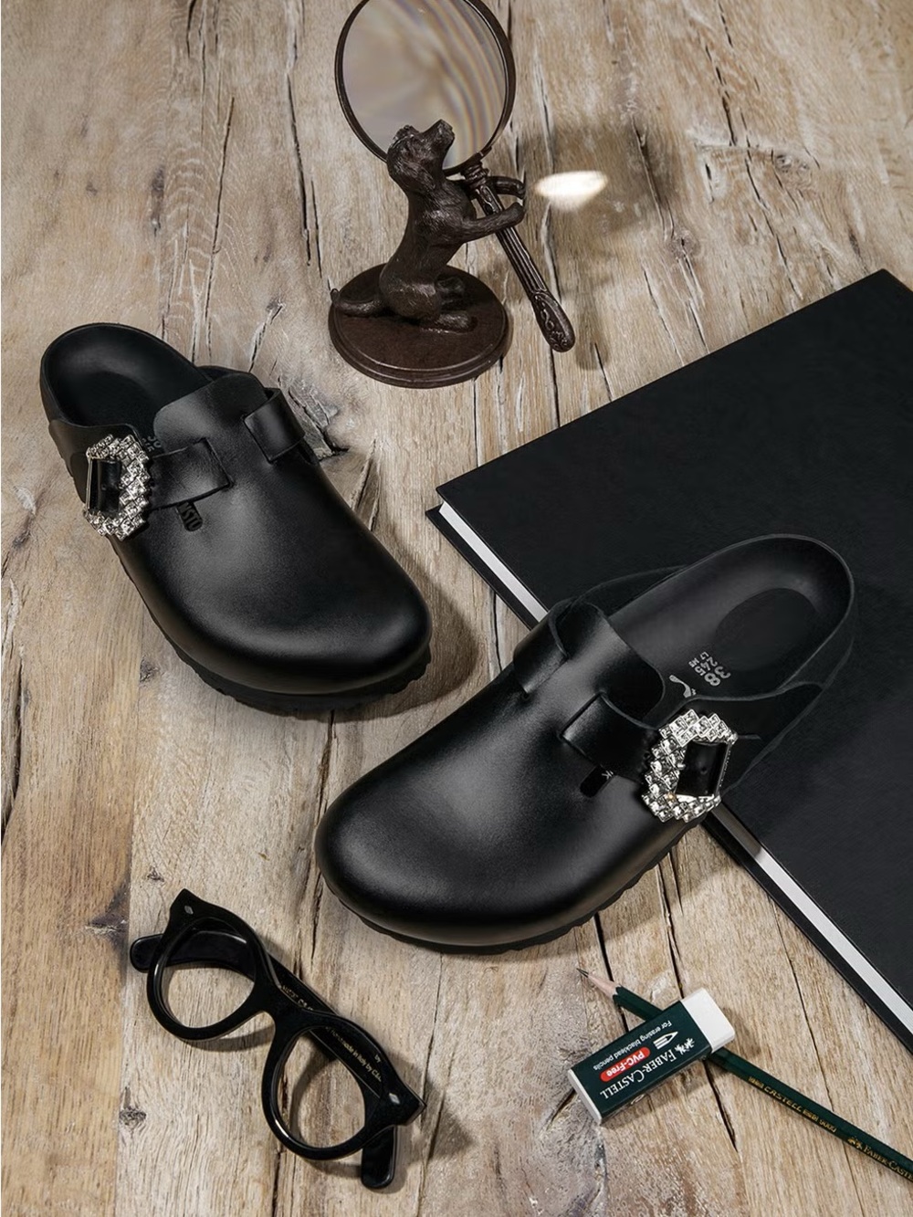 MANOLO BLAHNIK X BIRKENSTOCK
Black Leather Boston Clogs with Crystal Buckle
